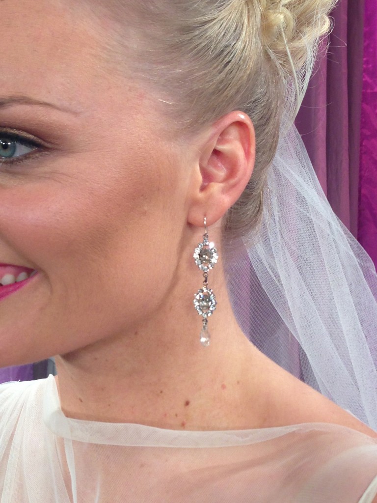 Tiered crystal earrings by Thomas Knoell for Watters Bride added sparkle and movement.